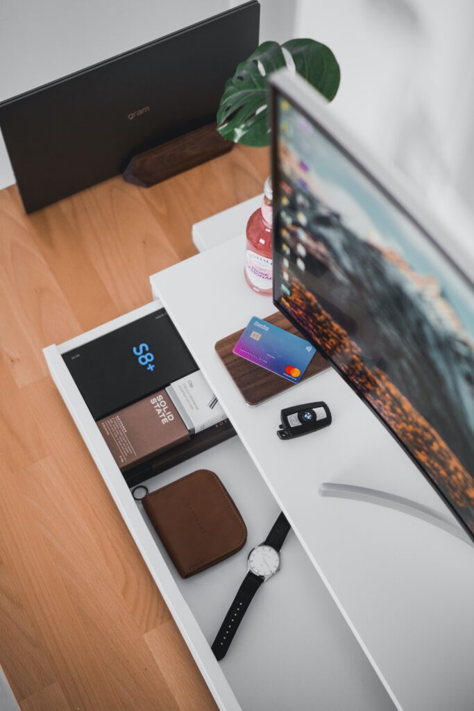 Office desk with computer screen on