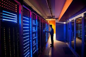 man standing by computer servers